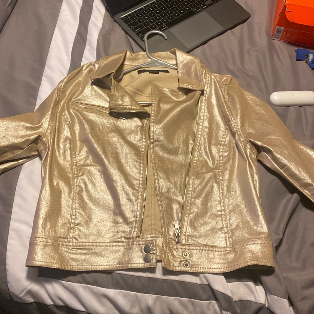Gold bomber jacket by Celebrity Pink.